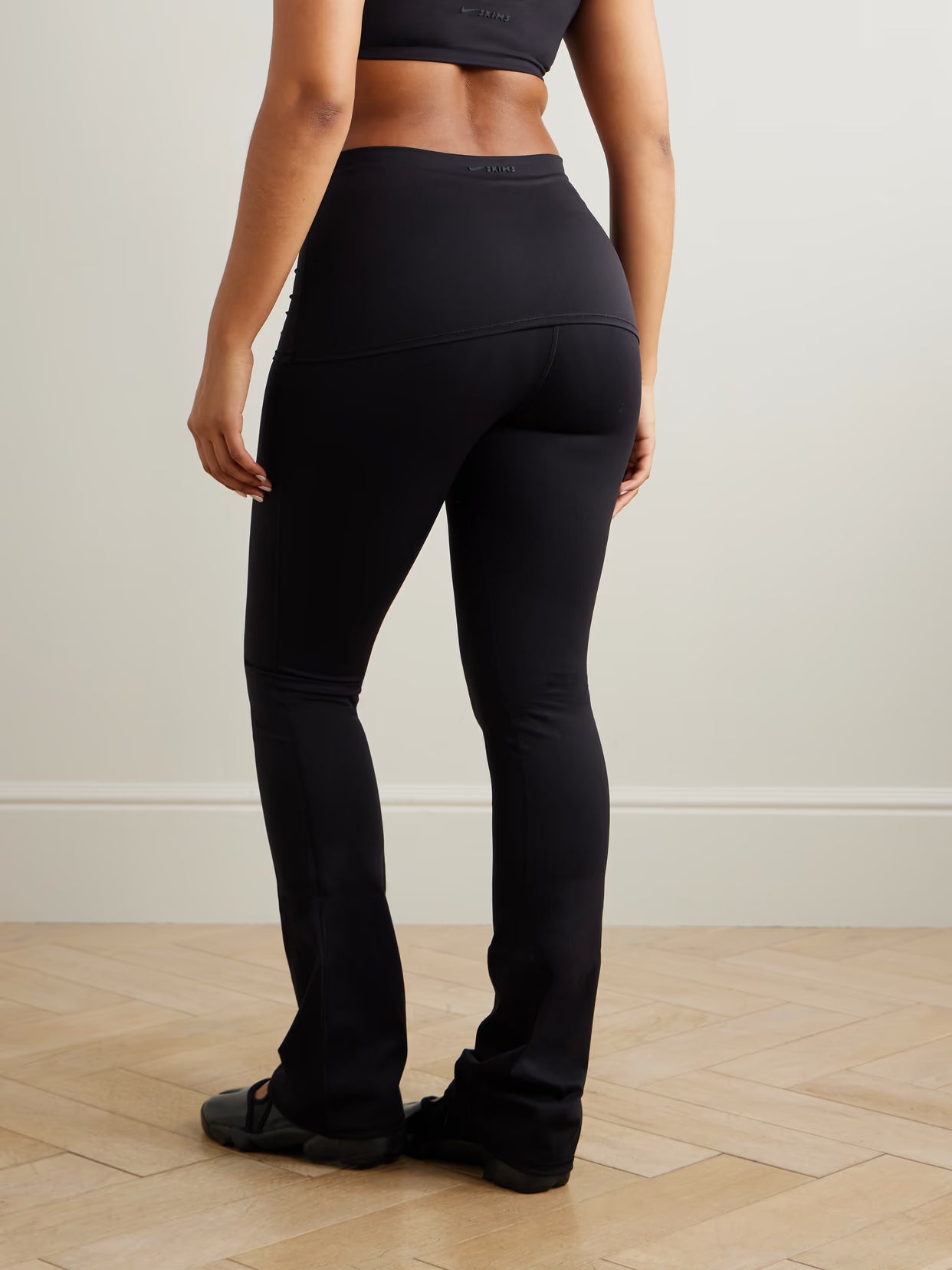 SKIMS - + Nike Foldover Slim Flare Legging - Obsidian